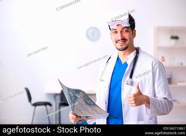 Young doctor wearing virtual glasses in the clinic