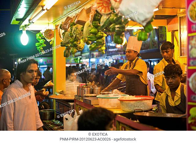 People at a food stall, Juhu Beach, Mumbai, Maharashtra, India