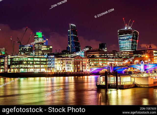 London, UK - May 20, 2014: City of London at night. The district City of London is one of the largest finanical centres of the world