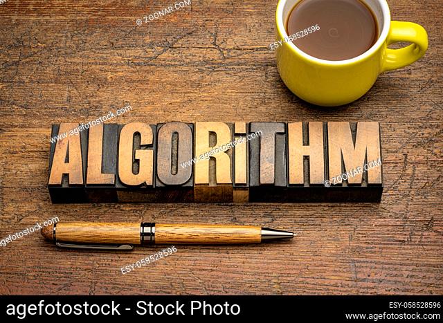 algorithm word abstract in vintage letterpress wood type with a cup of coffee, a process or set of rules to be followed in calculations or other problem-solving...