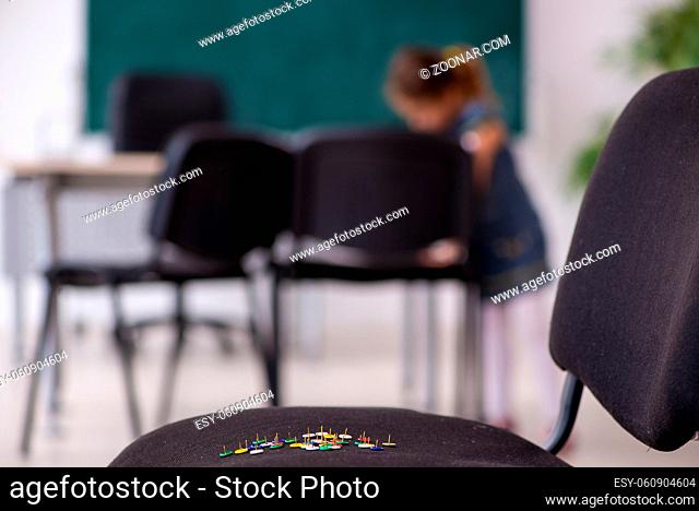 School prank with sharp thumbtacks on chair