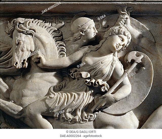 Roman civilization, 2nd century A.D. Marble sarcophagus with marble group on lid representing the deceased couple and relief depicting a battle between Greeks...