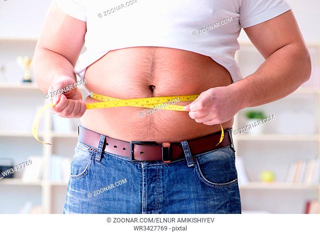 Fat obese man in dieting concept