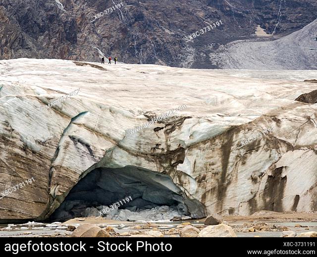 Climbers hiking on Glacier Pasterze at Mount Grossglockner, which is melting extremely fast due to global warming. Europe, Austria, Carinthia