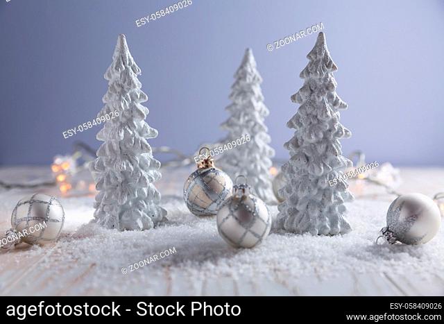 White trees with small Christmas balls as snowy landscape. Christmas decoration