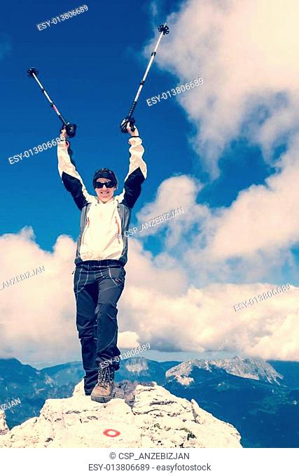 Female climber celebrating a successful ascend