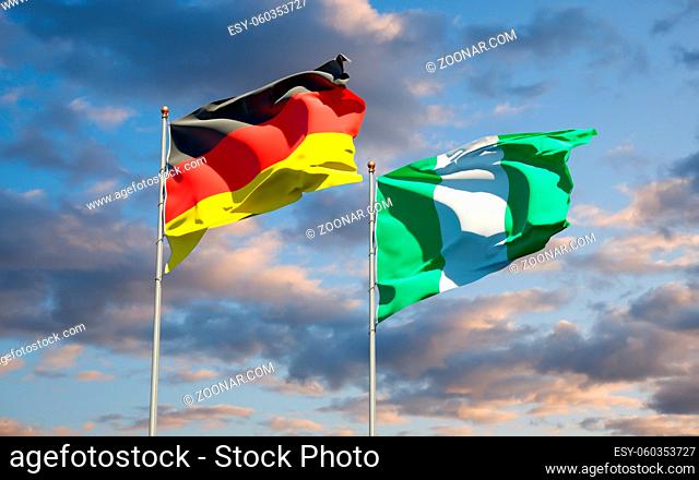 Beautiful national state flags of Germany and Nigeria together at the sky background. 3D artwork concept