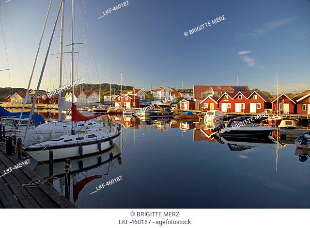Boats and boot houses in Bleket port, Tjoern Island, Province of Bohuslaen, West coast, Sweden, Europe