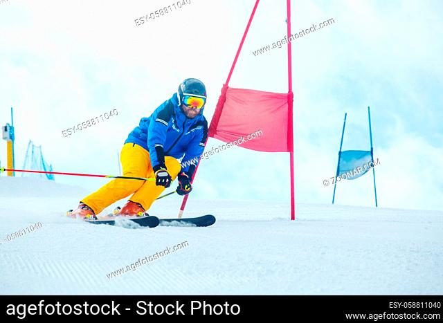 Gs Giant Slalom alpine ski racer skiing down the slope with gates sport winter training at Col Gallina Cortina d'Ampezzo Dolomites