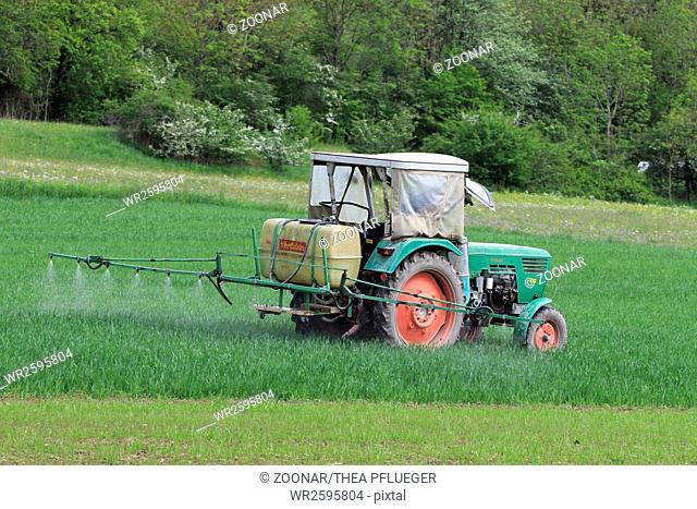 Old tractor with field syringe