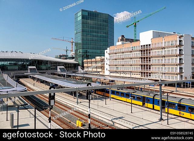 Utrecht, The Netherlands - May 15, 2018: Railway station Utrecht with waiting trains and travelers