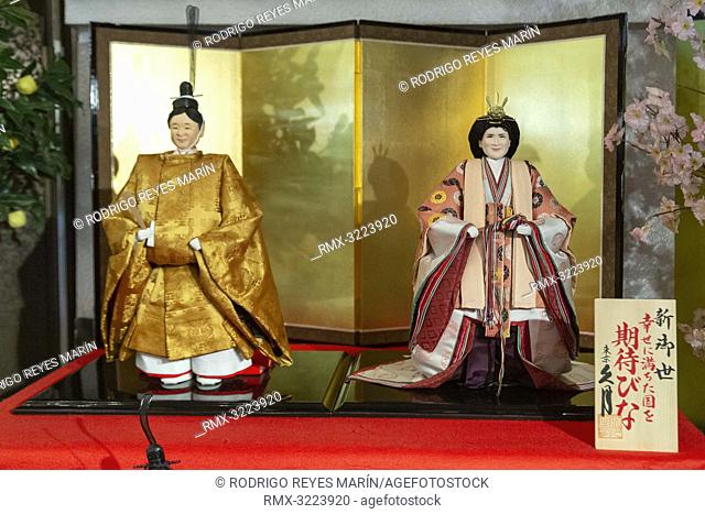 Japanese 'hina' dolls modeled after Crown Prince Naruhito (L) and Crown Princess Masako (R) on display at Kyugetsu Company's showroom