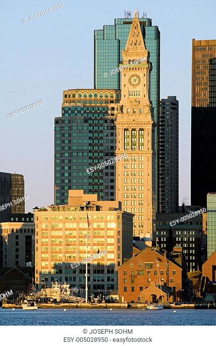 The Customs House Clock Tower and Boston skyline at sunrise, as seen from South Boston, Massachusetts, New England