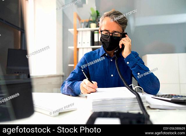 Business Man Talking On Phone Or Telephone In Mask