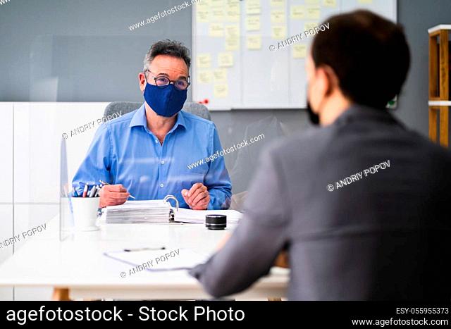 Business Tax Consultant Or Advisor Meeting With Face Mask