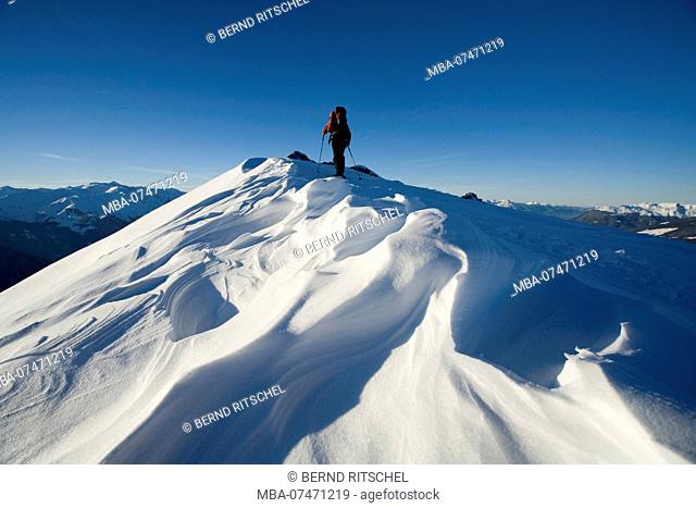 Snowshoe hikers on the summit ridge of the Geißkopf, Gerlos valley, Zillertal Alps, Tyrol, Austria