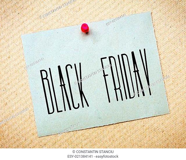 Recycled paper note pinned on cork board.Black Friday Message. Concept Image