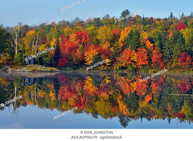 Autumn reflections in St. Pothier Lake, Greater Sudbury (Whitefish), Ontario, Canada