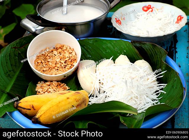 Homemade Vietnam sweet food for dessert, banana cream, raw material to make this eating are ripe banana, coconut milk, peanut, milk, copra