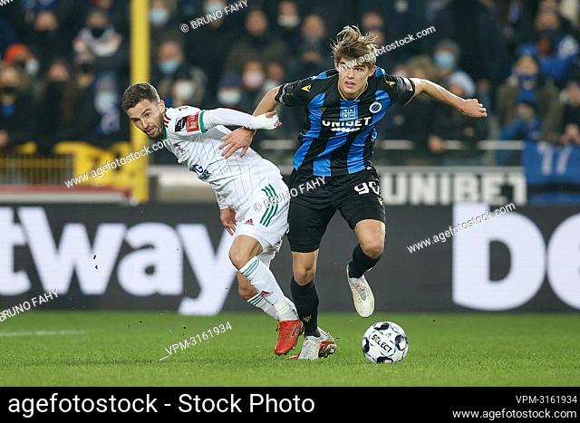 OHL's Siebe Schrijvers and Club's Charles De Ketelaere fight for the ball during a soccer game between Club Brugge and Oud-Heverlee Leuven