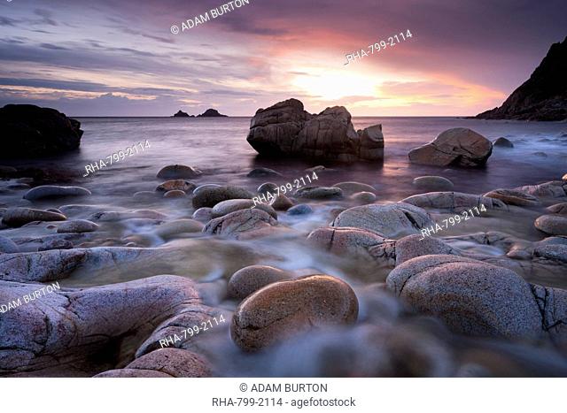 Sunset over the Brisons and Porth Nanven, a rocky cove near Land's End, Cornwall, England, United Kingdom, Europe