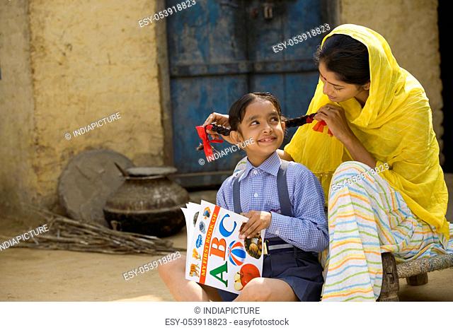 Rural mother playing with her daughter