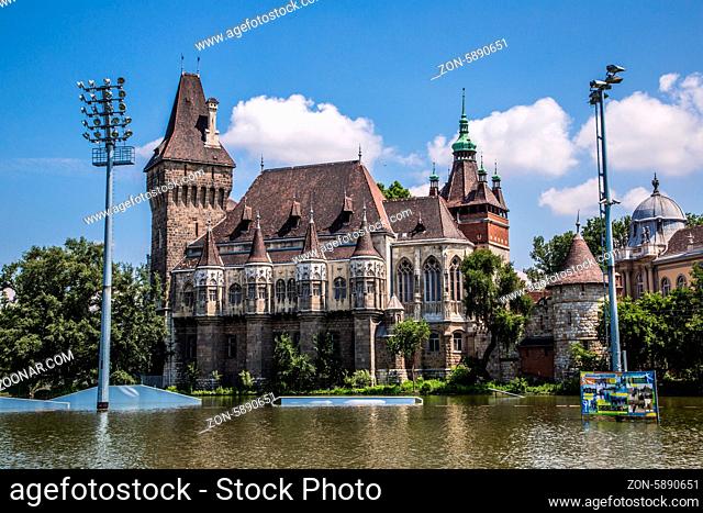 Historical building in Budapest - Vajdahunyad Castle with lake over the blue sky in main City Park. This is the similar castle like in Transilvania