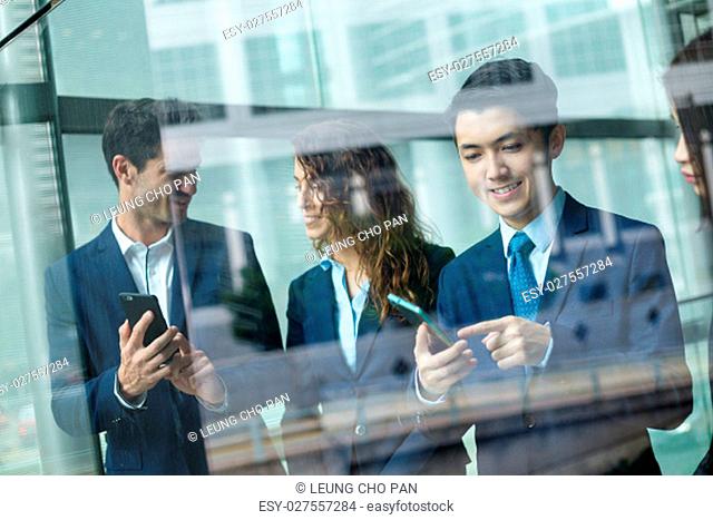 Group of business people use of cellphone