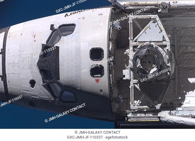 Space Shuttle Discovery's crew cabin and docking apparatus in the forward payload bay are featured in this close-up image photographed by an Expedition 16...