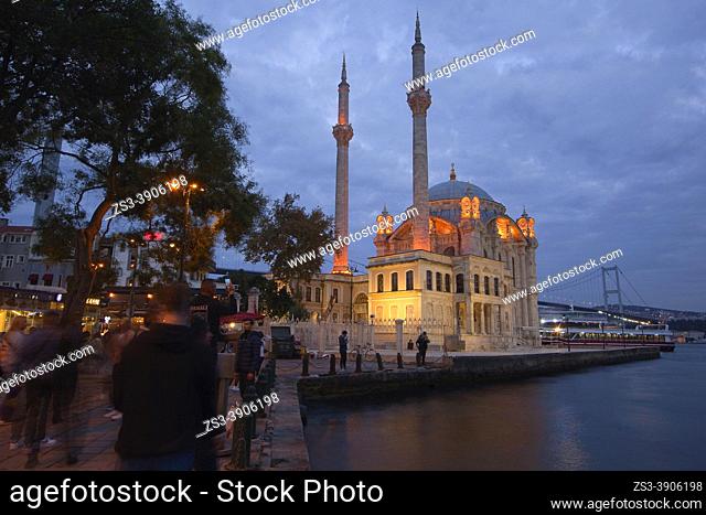 View to the Ortakoy Mosque or Buyuk Mecidiye Mosque on Bosphorus and to the Bosphorus bridge at the background by night, Ortakoy, Besiktas, Istanbul