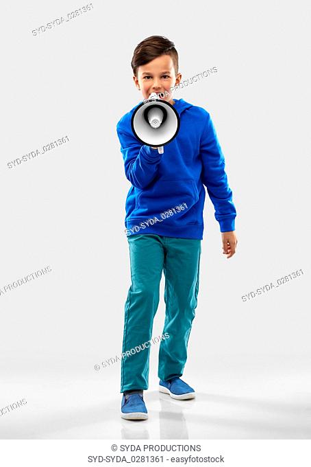 smiling boy speaking to megaphone