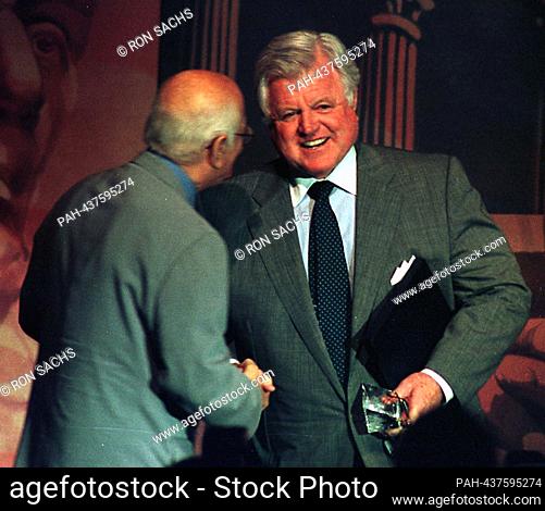United States Senator Edward M. ""Ted"" Kennedy (Democrat of Massachusetts) is congratulated by Norman Lear after he received the People for the American Way's...