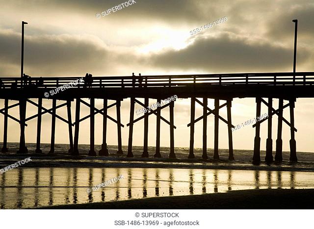 Tourists on a pier over the pacific ocean, Newport Beach, Orange County, California, USA