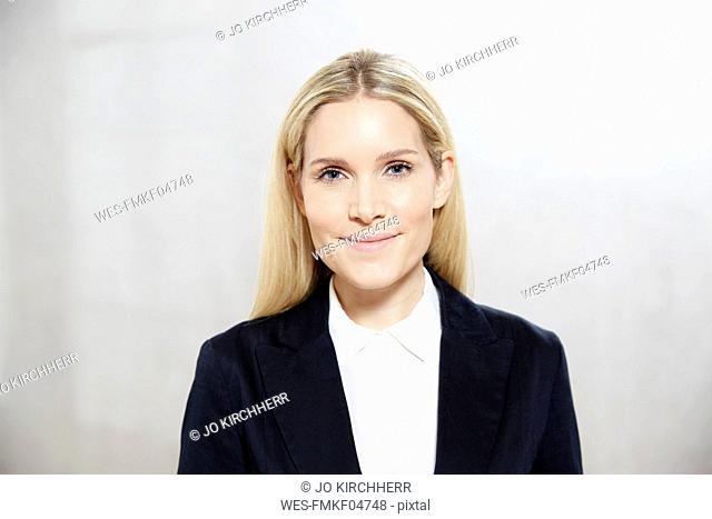 Portrait of smiling blond businesswoman