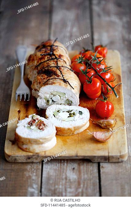 Turkey breast roulade stuffed with courgette, feta cheese and dried tomatoes