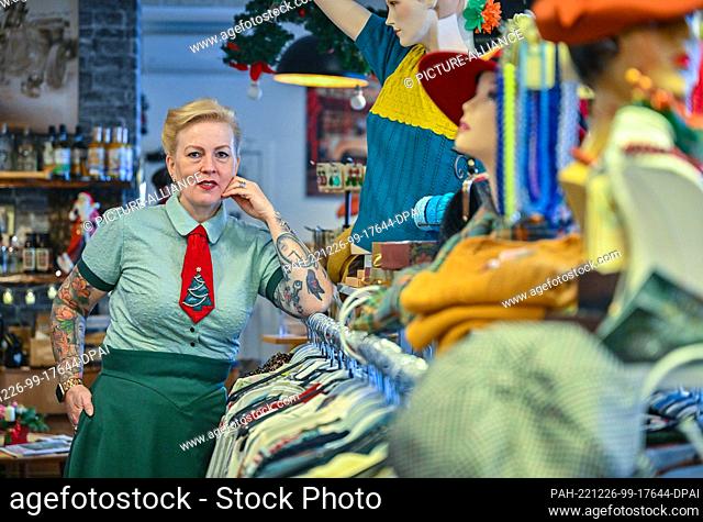 07 December 2022, Brandenburg, Werneuchen: Anna Lehradt, owner of the fashion store ""Dotty&Dan"", stands in her store. ""Dotty&Dan"" in Werneuchen is not just...