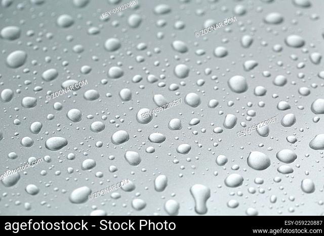 Water drops on a shiny metal surface