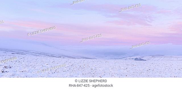 Soft pastel colours at dawn on Pockstones Moor, looking towards Appletreewick Pasture and Grimwith Reservoir, North Yorkshire, Yorkshire, England