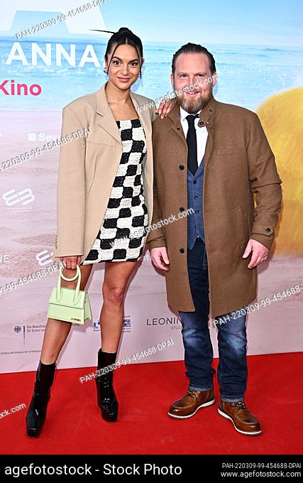 09 March 2022, Bavaria, Munich: Actors Taneshia Abt and Axel Stein stand during the premiere of the film ""JGA: Jasmin. Gina. Anna