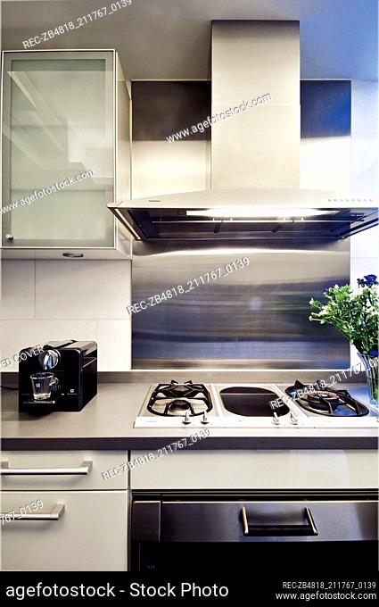 Extractor fan above gas hob in modern kitchen