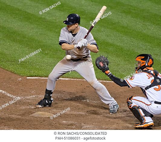 New York Yankees third baseman Chase Headley (12) watches a pitch go by as he bats in the eighth inning against the Baltimore Orioles at Oriole Park at Camden...