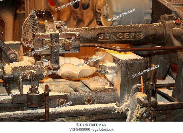 Machine in a workshop used to make traditional Dutch wooden shoes in the small town of Zaanse Schans, Holland, Netherlands, Europe
