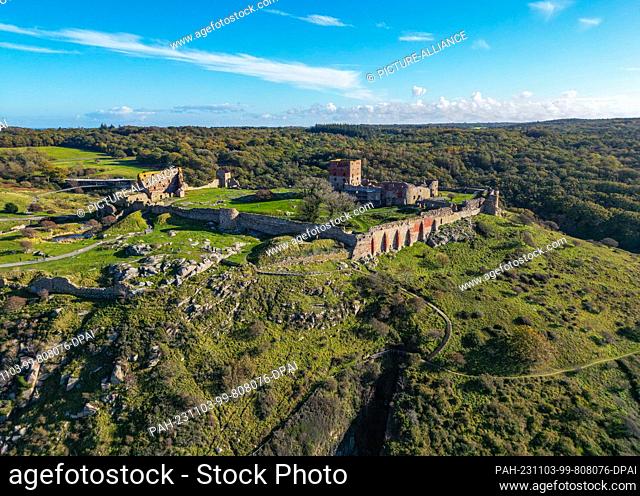 23 October 2023, Denmark, Vang: View of the ruins of the medieval fortress Hammershus on the north-western tip of the Danish island in the Baltic Sea (aerial...