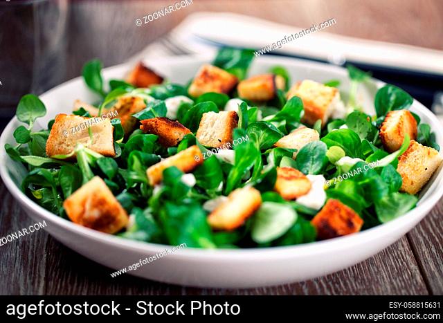 Delicious caesar salad with homemade croutons and dressing.. High quality photo