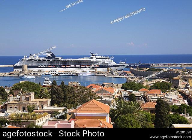 Old town of Rhodes and Celebrity X Infinity cruise ship docked in port, Rhodes, Greece