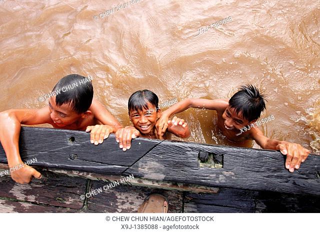 A group of Iban Dayak children swimming on the River near Pusa in Sarawak, northwest Borneo, Malaysia, Southeast Asia, Asia