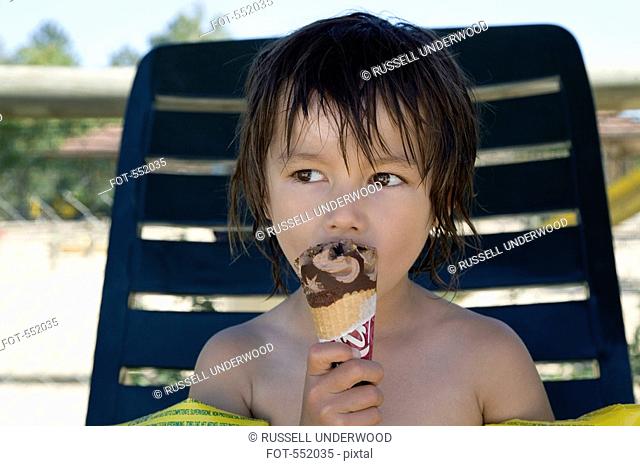 A boy eating an ice cream