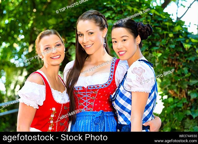 female friends in Tracht, and Dirndl in Bavaria, Germany