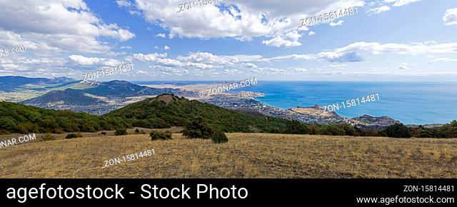 Panoramic view from the top of Mount Perchem to the Black Sea coast near the resort town of Sudak, Crimea. Sunny day in September