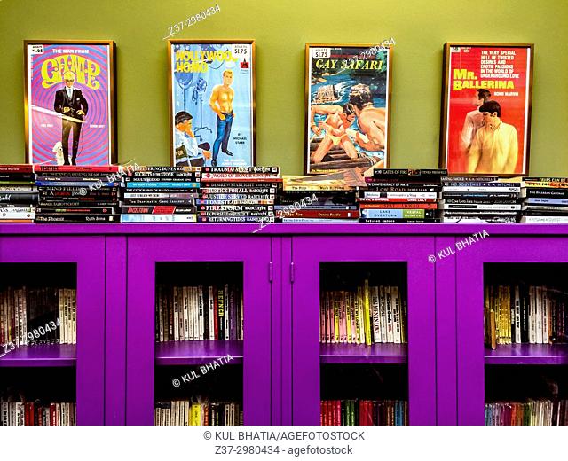 Homosexual posters, books, and videos in a Pride library, Ontario, Canada. The reddish purple colour is an iconic colour in gay culture